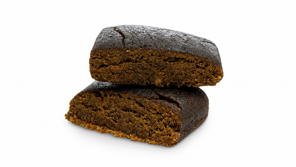 Pressed hash cut in half showing dense texture, an example of properly stored concentrate that stays fresh over time.